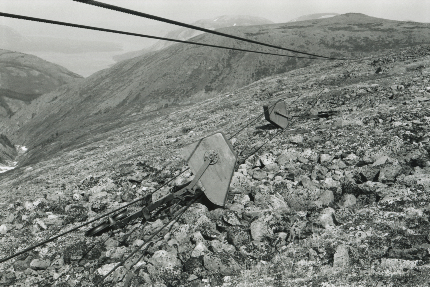 Buckets on a fallen section of the Mountain Hero aerial tramway, at 1515m elevation.