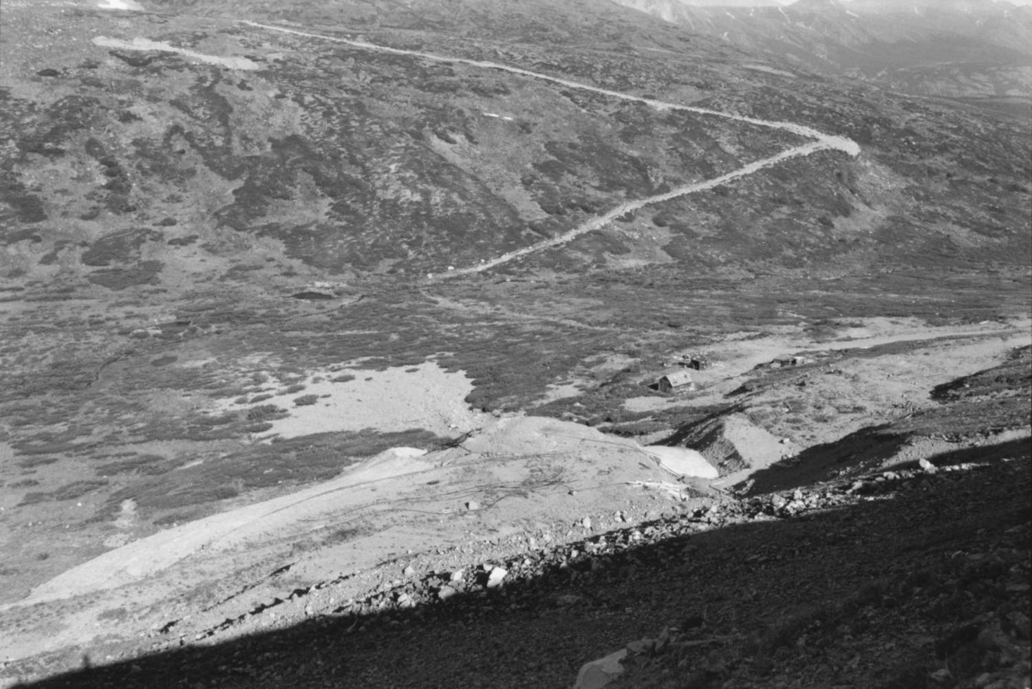 Mine camp, originally staked as the Big Thing by Willard Phelps in 1906, later operated as the Peerless.