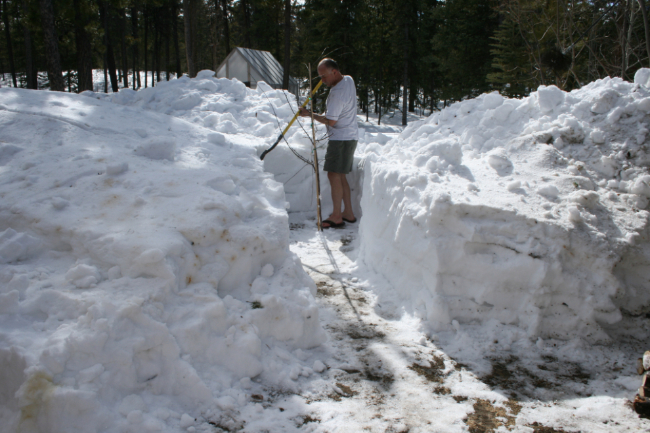 Dealing with deep snow at our home at Mary Lake, Yukon