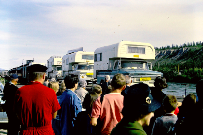 Camper trucks ontWhite Pass & Yukon Route railway flatcars at Whitehorse, July 1966