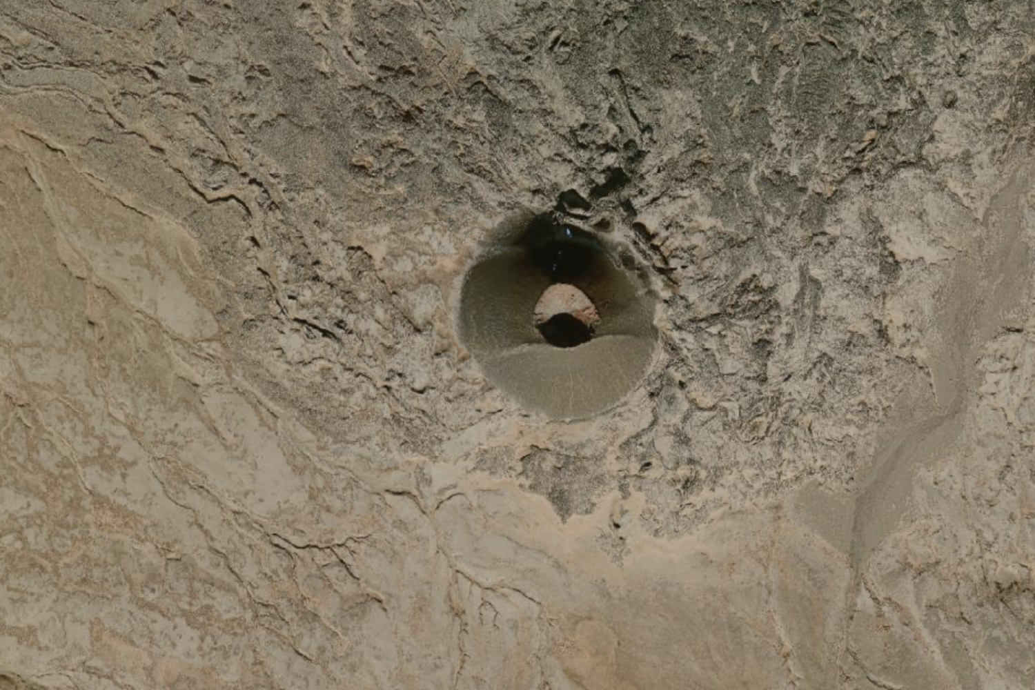 A satellite photo of Eve Cone on the northern slopes of Mount Edziza, from the USGS EarthExplorer.