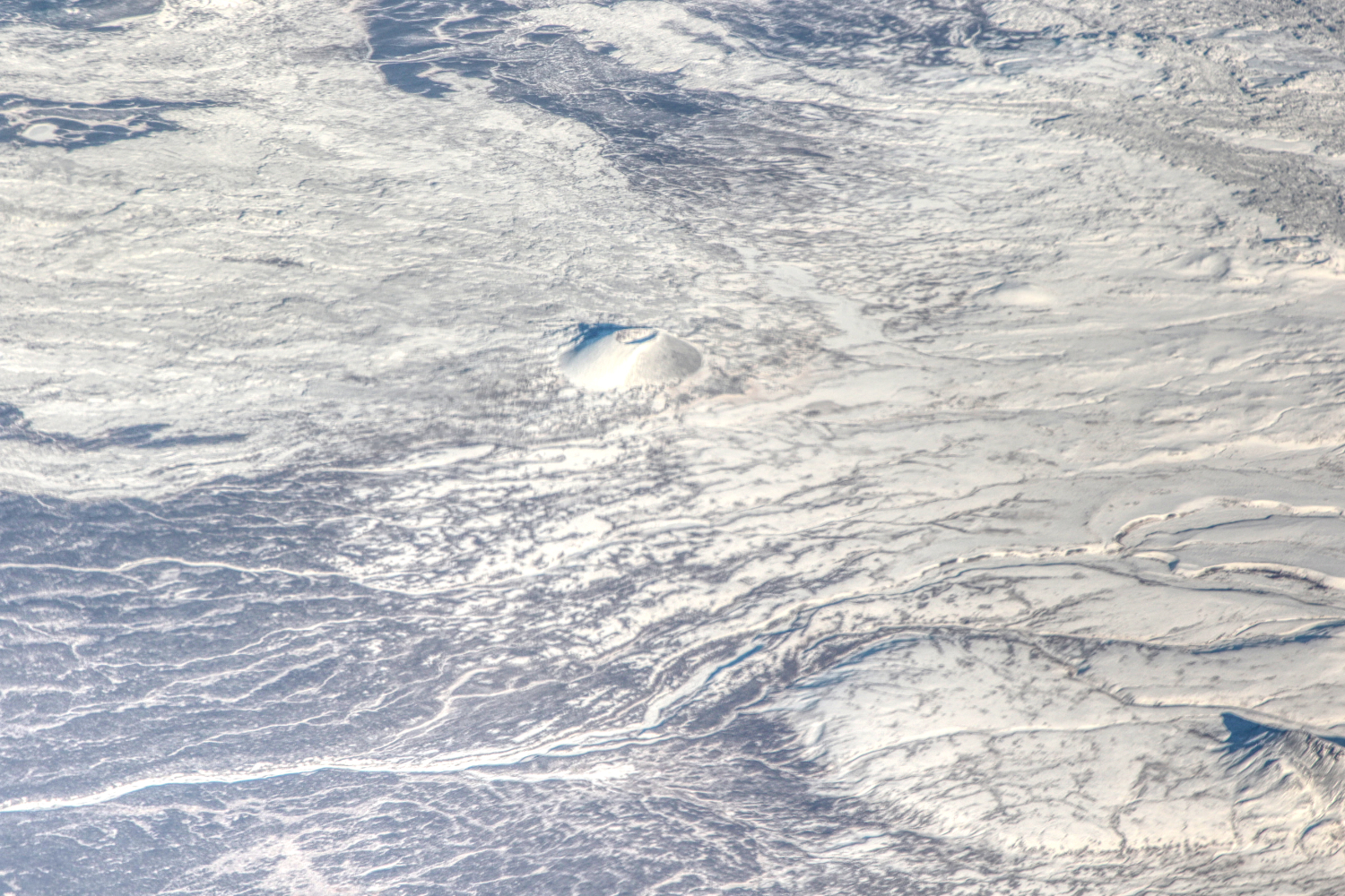 A high-altitude aerial photo of Eve Cone on Mount Edziza on October 24, 2023.