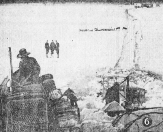 Bulldozer being pulled from ice through which it crashed on the Muskwa River, 1941