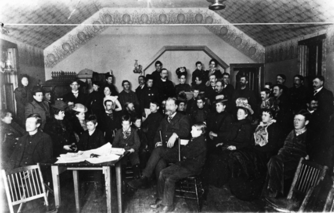 The Rev. Wright and his congregation in the Presbyterian Church at Whitehorse, Yukon Territory, 1900