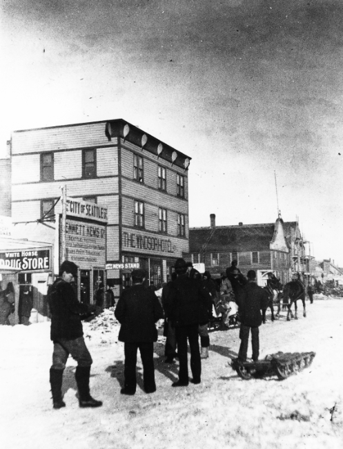 Front Street, with White Horse Drugs, the Bennett News, The Windsor Hotel, etc. - Whitehorse, Yukon Territory, 1900